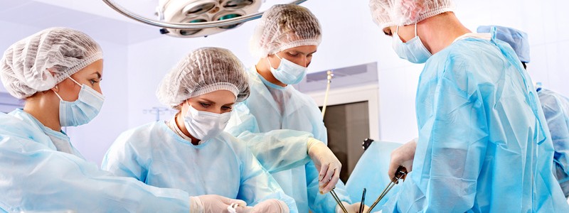 Surgeon at work in operating room.
